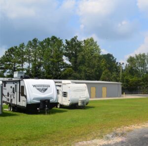 Winnebago RV and Classic Cruiser camper parked in boat and RV storage area at AA Self Storage in Jacksonville NC