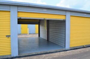 open climate controlled storage unit with yellow roll-up doors at AA Self Storage in Jacksonville NC showing interior space