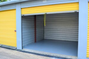 open climate controlled storage with yellow roll-up doors at AA Self Storage in Jacksonville NC showing empty interior