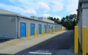 R-Ext-CC-Bldg-Blue-Bollards-Stop-scaled
